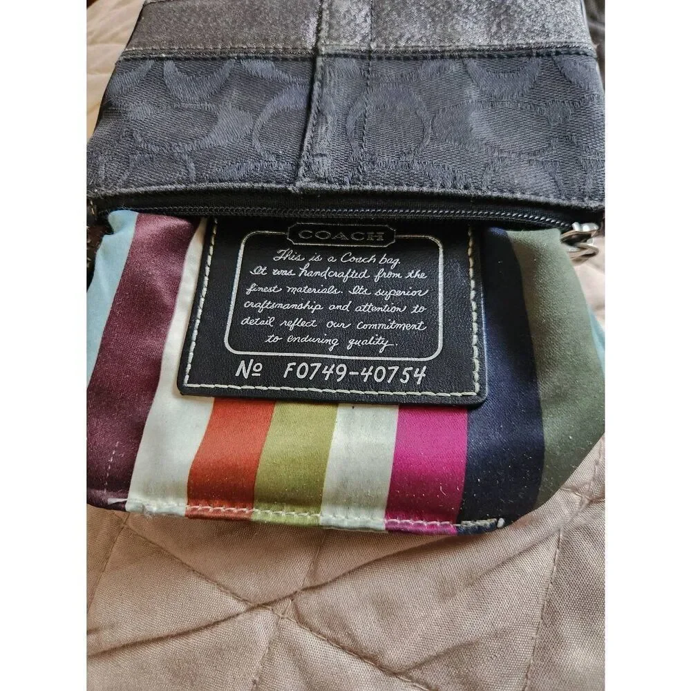 Coach black Signature Jacquard small Zip Wristlet with 65th anniversary lining